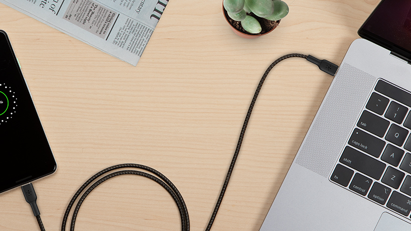 BOOSTCHARGE braided cable plugging a smartphone into a Macbook
