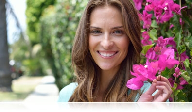 D5300 photo of a woman holding a pink flower