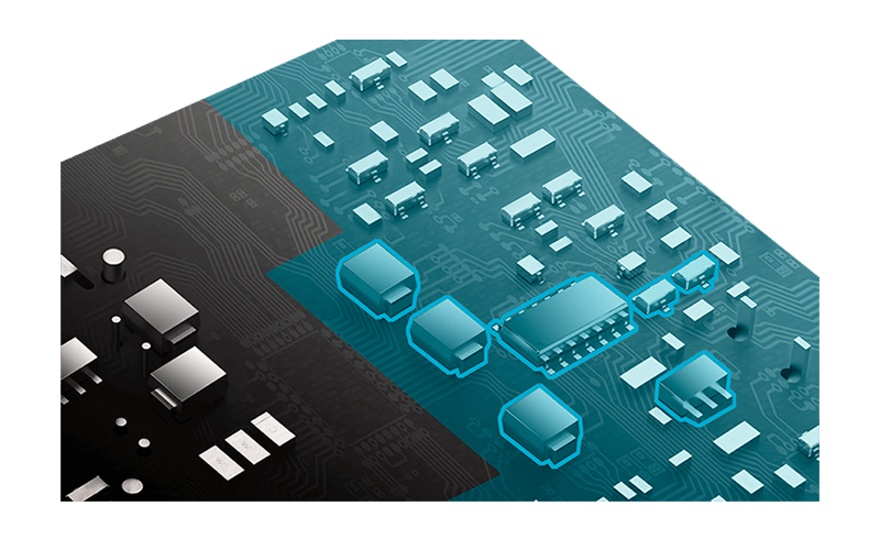 Close-up of a computer circuit board with a layer of blue covers to showcase the protective PCB coating on the PCB